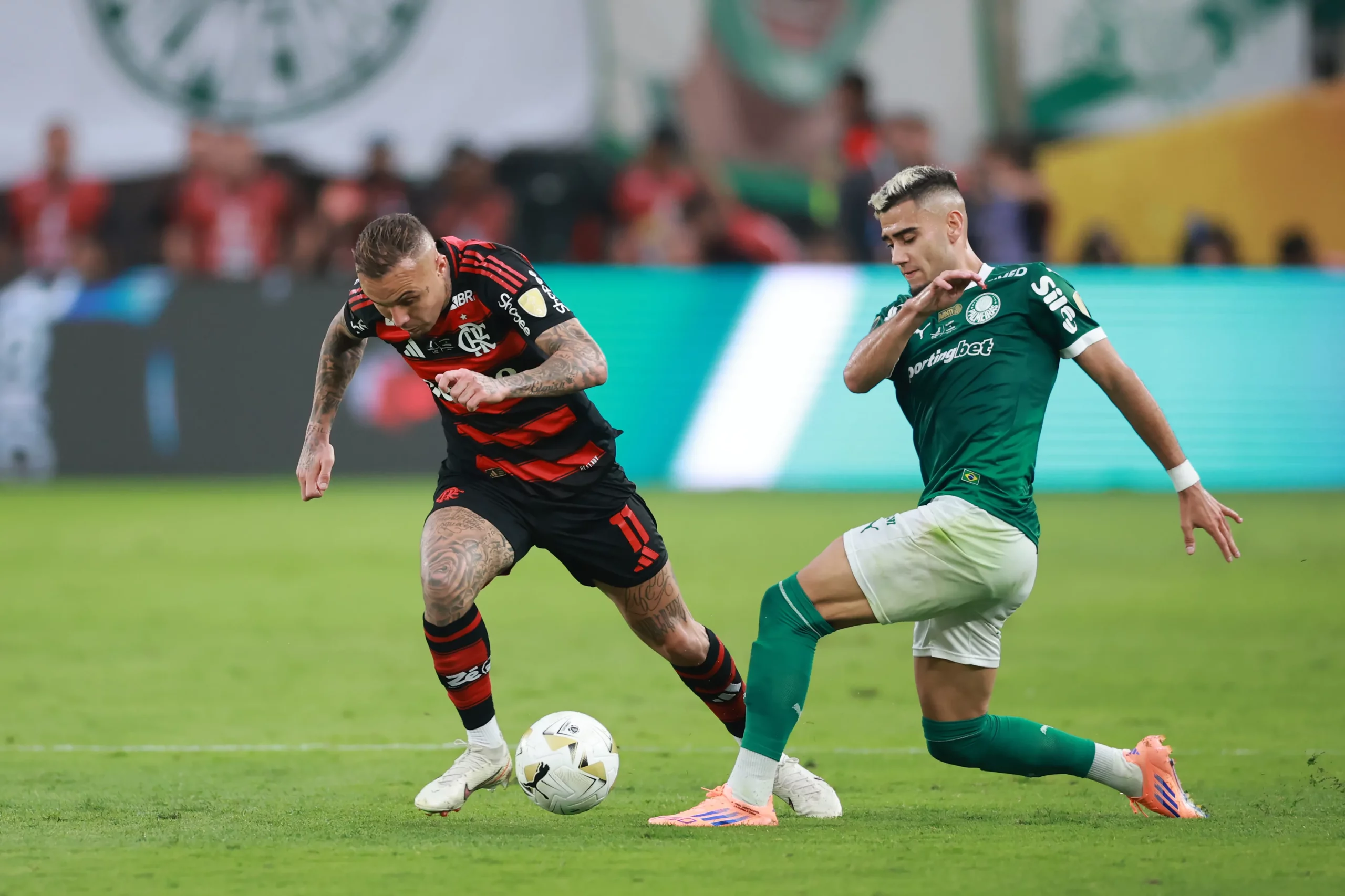 LIMA, PERU – NOVEMBER 29: Everton of Flamengo is challenged by Andreas Pereira of Palmeiras during the 2025 Copa CONMEBOL Libertadores Final match between Palmeiras and Flamengo at Estadio Monumental on November 29, 2025 in Lima, Peru.  (Photo by Hector Vivas/Getty Images)