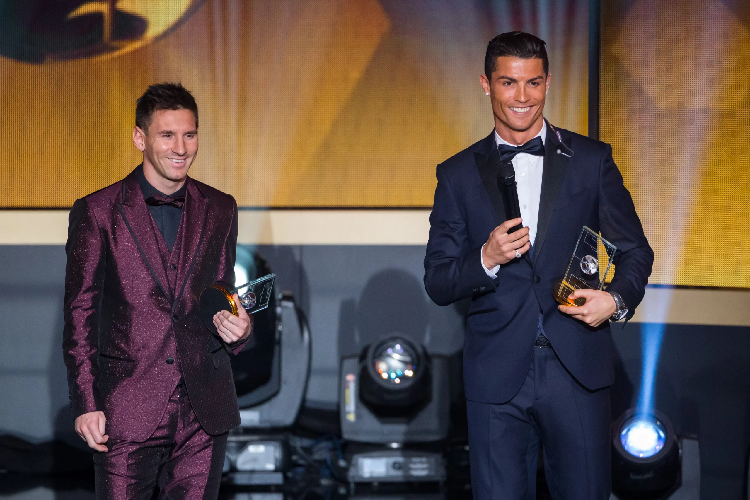 ZURICH, SWITZERLAND – JANUARY 12: FIFA Ballon d’Or nominees Lionel Messi of Argentina and FC Barcelona  (L) and Cristiano Ronaldo of Portugal and Real Madrid smile during the FIFA Ballon d’Or Gala 2014 at the Kongresshaus on January 12, 2015 in Zurich, Switzerland. (Photo by Philipp Schmidli/Getty Images)