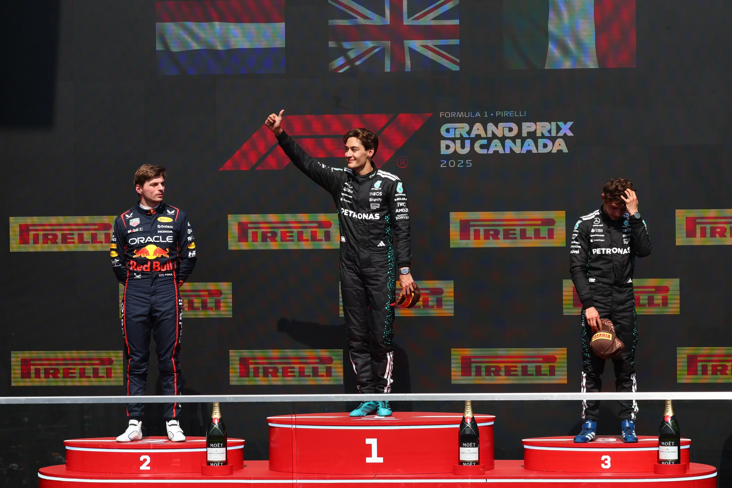 MONTREAL, QUEBEC – JUNE 15: Race winner George Russell of Great Britain and Mercedes AMG Petronas F1 Team, Second placed Max Verstappen of the Netherlands and Oracle Red Bull Racing and Third placed Andrea Kimi Antonelli of Italy and Mercedes AMG Petronas F1 Team stand on the podium during the F1 Grand Prix of Canada at Circuit Gilles-Villeneuve on June 15, 2025 in Montreal, Quebec. (Photo by Clive Rose/Getty Images)