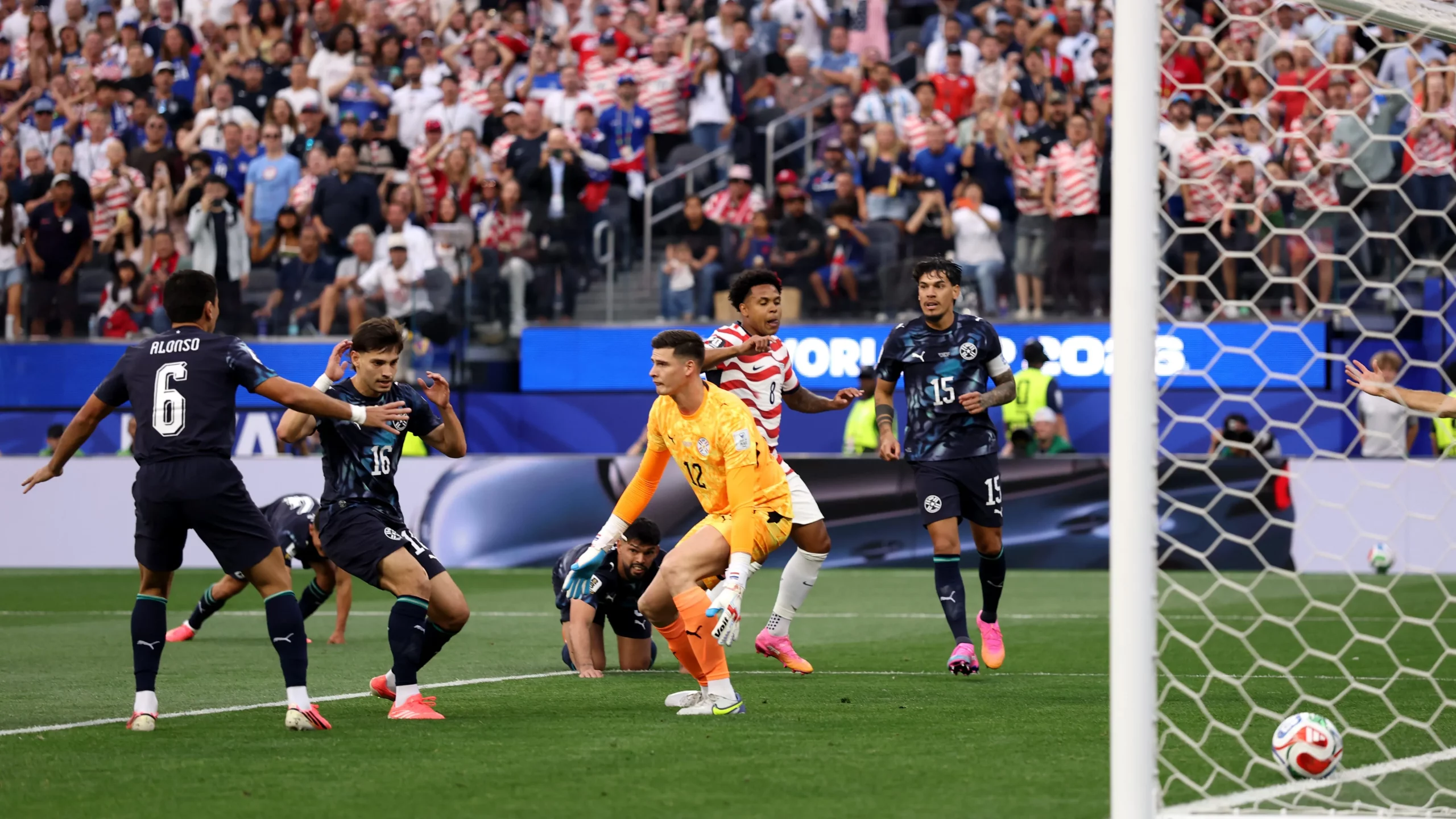 LOS ANGELES, CALIFORNIA – JUNE 12: Damian Bobadilla #16 of Paraguay reacts as a shot deflects off him leading to the first goal for the United States during the FIFA World Cup 2026 Group D match between USA and Paraguay at Los Angeles Stadium on June 12, 2026 in Los Angeles, California. (Photo by Richard Heathcote/Getty Images)