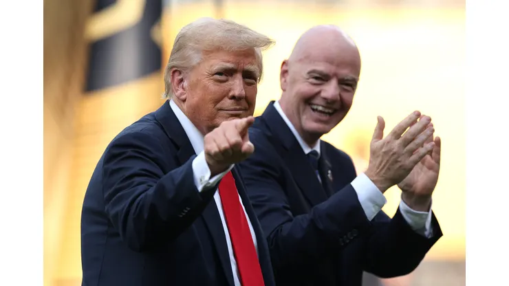 EAST RUTHERFORD, NEW JERSEY - JULY 13: U.S. President Donald Trump gestures as Gianni Infantino, President of FIFA applauds following the FIFA Club World Cup 2025 Final match between Chelsea FC and Paris Saint-Germain at MetLife Stadium on July 13, 2025 in East Rutherford, New Jersey. (Photo by Alex Grimm/Getty Images)