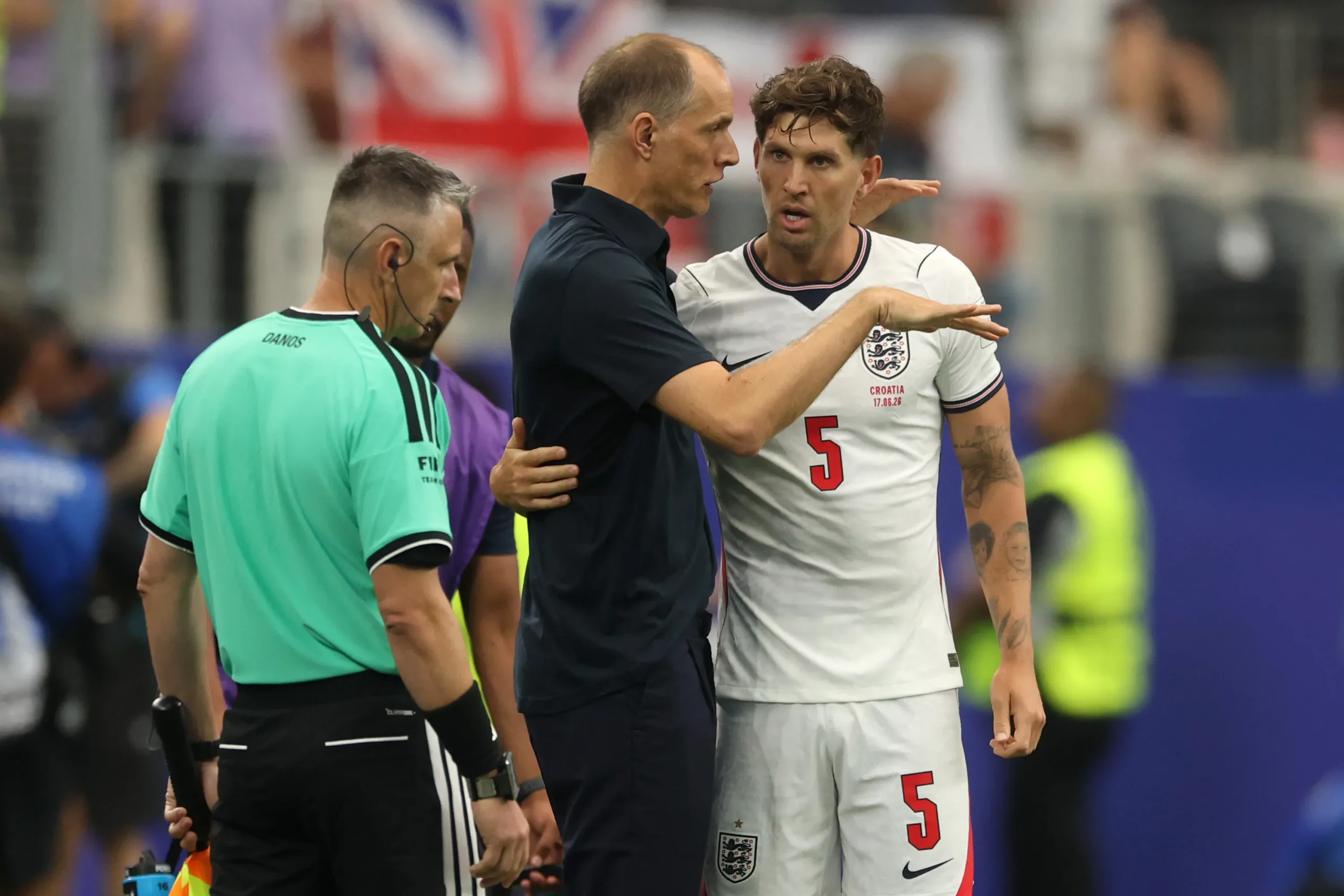 ARLINGTON, TEXAS – JUNE 17: Thomas Tuchel, Manager of England, speaks with John Stones #5 during the FIFA World Cup 2026 Group L match between England and Croatia at Dallas Stadium on June 17, 2026 in Arlington, Texas. (Photo by Richard Pelham/Getty Images)
