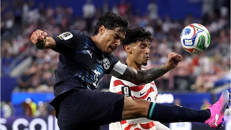 LOS ANGELES, CALIFORNIA - JUNE 12: Gustavo Gómez #15 of Paraguay and Ricardo Pepi #9 of the United States compete for the ball during the FIFA World Cup 2026 Group D match between USA and Paraguay at Los Angeles Stadium on June 12, 2026 in Los Angeles, California. (Photo by Jamie Squire/Getty Images)