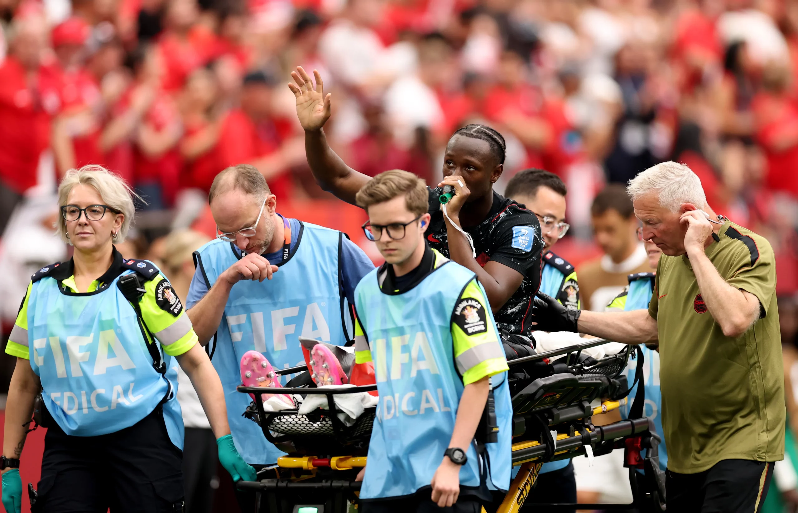 VANCOUVER, BRITISH COLUMBIA – JUNE 18: Ismael Kone #8 of Canada waves to crowd as he is stretched off after being fouled by Assim Madibo #23 of Qatar during the FIFA World Cup 2026 Group B match between Canada and Qatar at BC Place Vancouver on June 18, 2026 in Vancouver, British Columbia. (Photo by Fran Santiago/Getty Images)