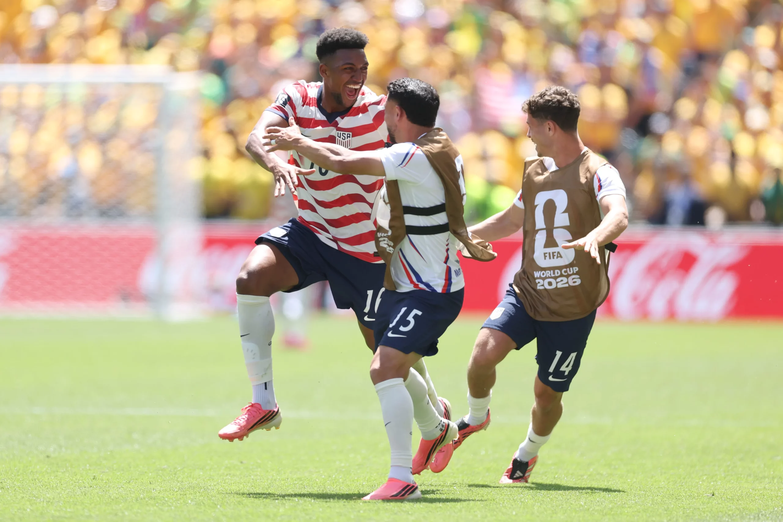 SEATTLE, WASHINGTON – JUNE 19: Alex Freeman #16 of the United States celebrates with teammate Cristian Roldan #15 after scoring his team’s second goal during the FIFA World Cup 2026 Group D match between USA and Australia at Seattle Stadium on June 19, 2026 in Seattle, Washington. (Photo by Jamie Squire/Getty Images)