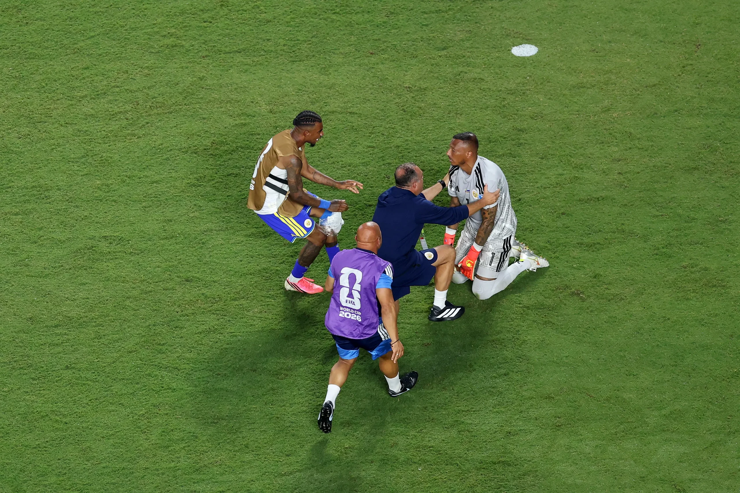 KANSAS CITY, MISSOURI – JUNE 20: Eloy Room #1 of Curacao is embraced by teammates the 0-0 draw during the FIFA World Cup 2026 Group E match between Ecuador and Curacao at Kansas City Stadium on June 20, 2026 in Kansas City, Missouri. (Photo by Michael Steele/Getty Images)
