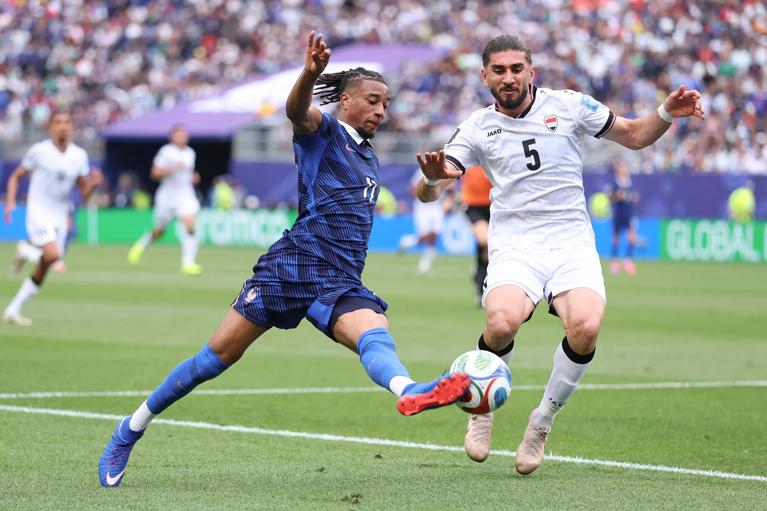 PHILADELPHIA, PENNSYLVANIA – JUNE 22: Michael Olise #11 of France takes on Akam Hashim #5 of Iraq during the FIFA World Cup 2026 Group I match between France and Iraq at Philadelphia Stadium on June 22, 2026 in Philadelphia, Pennsylvania. (Photo by Kevin C. Cox/Getty Images)