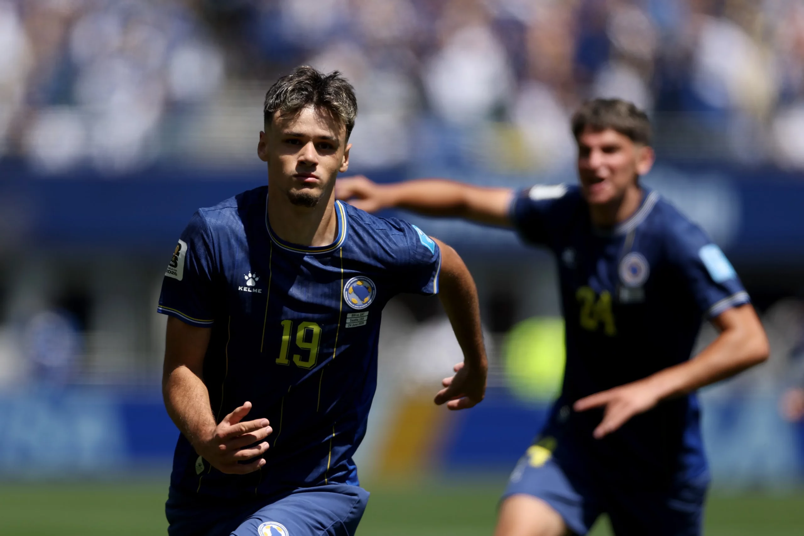 SEATTLE, WASHINGTON – JUNE 24: Kerim Alajbegovic #19 of Bosnia and Herzegovina celebrates scoring his team’s first goal during the FIFA World Cup 2026 Group B match between Bosnia and Herzegovina and Qatar at Seattle Stadium on June 24, 2026 in Seattle, Washington. (Photo by Stu Forster/Getty Images)