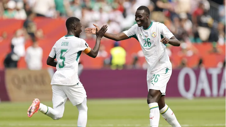 TORONTO, ONTARIO - JUNE 26: Pape Gueye #26 of Senegal celebrates with teammate Idrissa Gana Gueye #5 after scoring his team's fourth goal during the FIFA World Cup 2026 Group I match between Senegal and Iraq at Toronto Stadium on June 26, 2026 in Toronto, Ontario. (Photo by Michael Reaves/Getty Images)