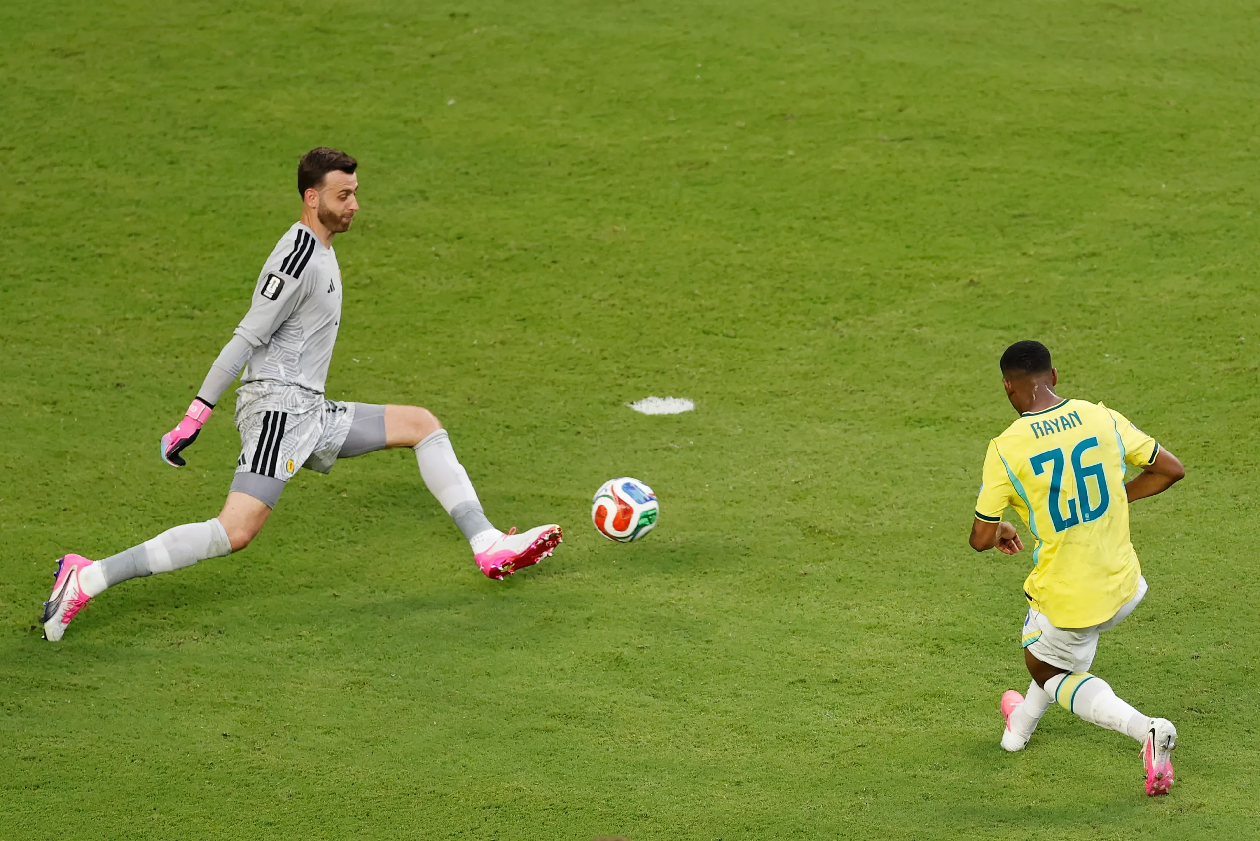MIAMI GARDENS, FLORIDA – JUNE 24: Angus Gunn #1 of Scotland makes a save against Rayan #26 of Brazil during the FIFA World Cup 2026 Group C match between Scotland and Brazil at Miami Stadium on June 24, 2026 in Miami Gardens, Florida. (Photo by Michael Reaves/Getty Images)