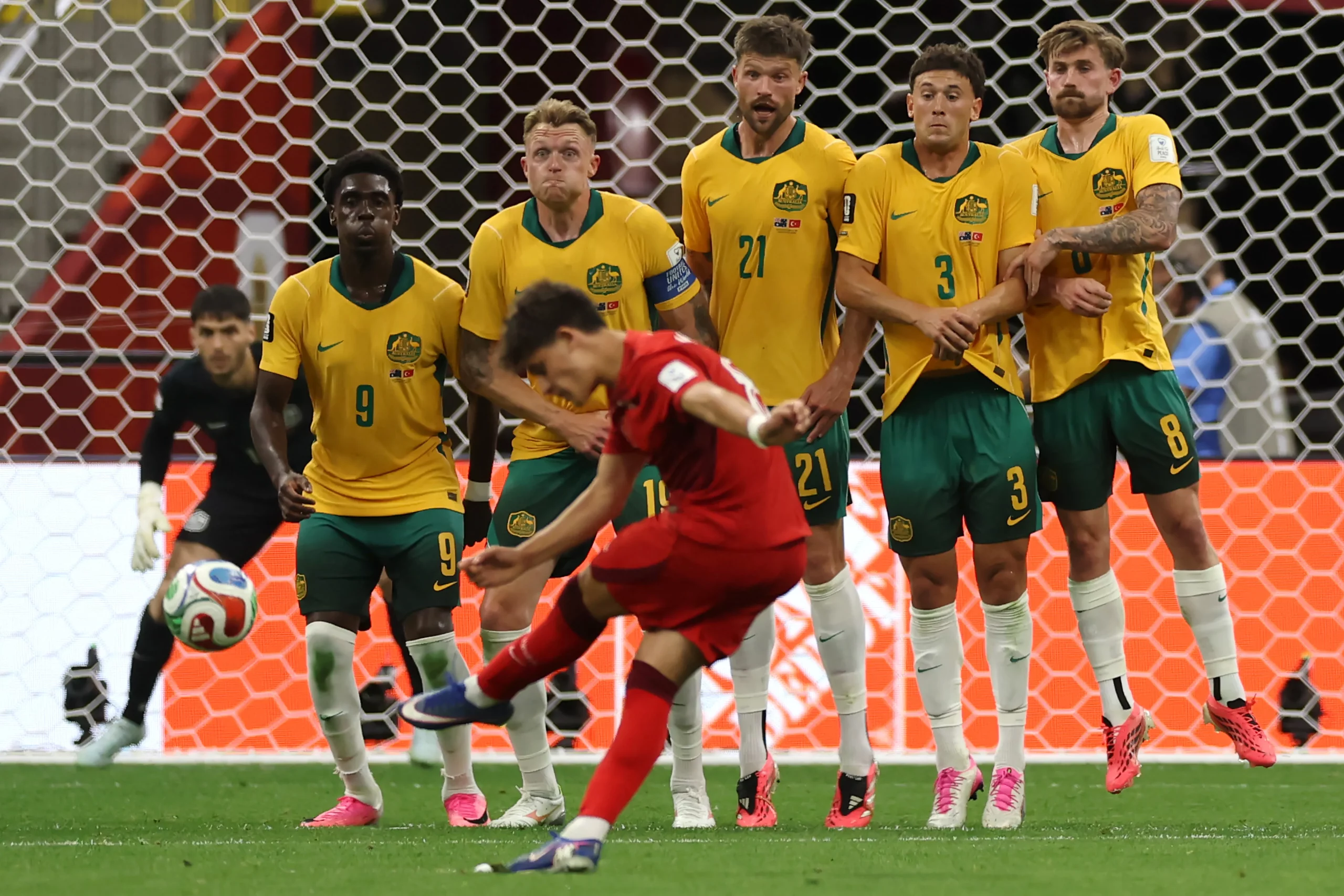 VANCOUVER, BRITISH COLUMBIA – JUNE 13:  Arda Guler of Turkiye takes a free kick on goal as Mohamed Toure, Harry Souttar, Cameron Burgess, Alessandro Circati and Connor Metcalfe of Australia jump in the defensive wall during the FIFA World Cup 2026 Group D match between Australia and Türkiye at BC Place Vancouver on June 13, 2026 in Vancouver, British Columbia. (Photo by Dean Mouhtaropoulos/Getty Images)