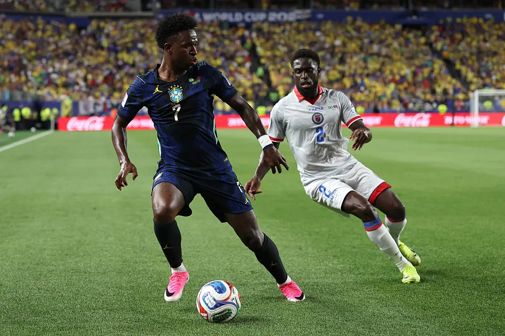 PHILADELPHIA, PENNSYLVANIA – JUNE 19: Vinicius Junior #7 of Brazil controls the ball under pressure from Carlens Arcus #2 of Haiti during the FIFA World Cup 2026 Group C match between Brazil and Haiti at Philadelphia Stadium on June 19, 2026 in Philadelphia, Pennsylvania. (Photo by Darrian Traynor/Getty Images)