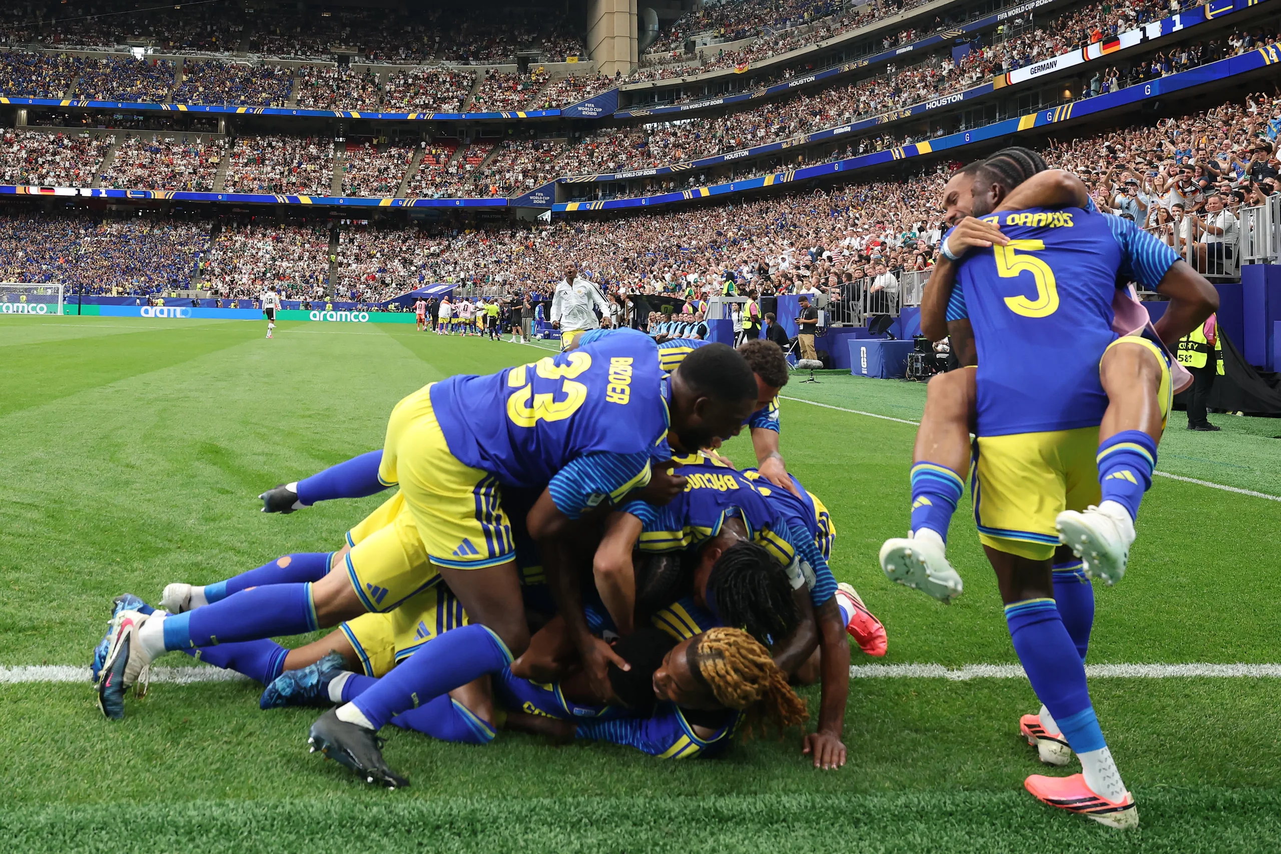HOUSTON, TEXAS – JUNE 14: Livano Comenencia #8 of Curacao celebrates scoring his team’s first goal during the FIFA World Cup 2026 Group E match between Germany and Curacao at Houston Stadium on June 14, 2026 in Houston, Texas. (Photo by Alexander Hassenstein/Getty Images)