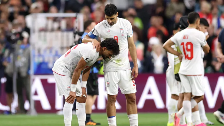 SEATTLE, WASHINGTON - JUNE 26: Ramin Rezaeian #23 and Mehdi Taremi #9 of IR Iran react after the 1-1 draw during the FIFA World Cup 2026 Group G match between Egypt and IR Iran at Seattle Stadium on June 26, 2026 in Seattle, Washington. (Photo by Richard Heathcote/Getty Images)