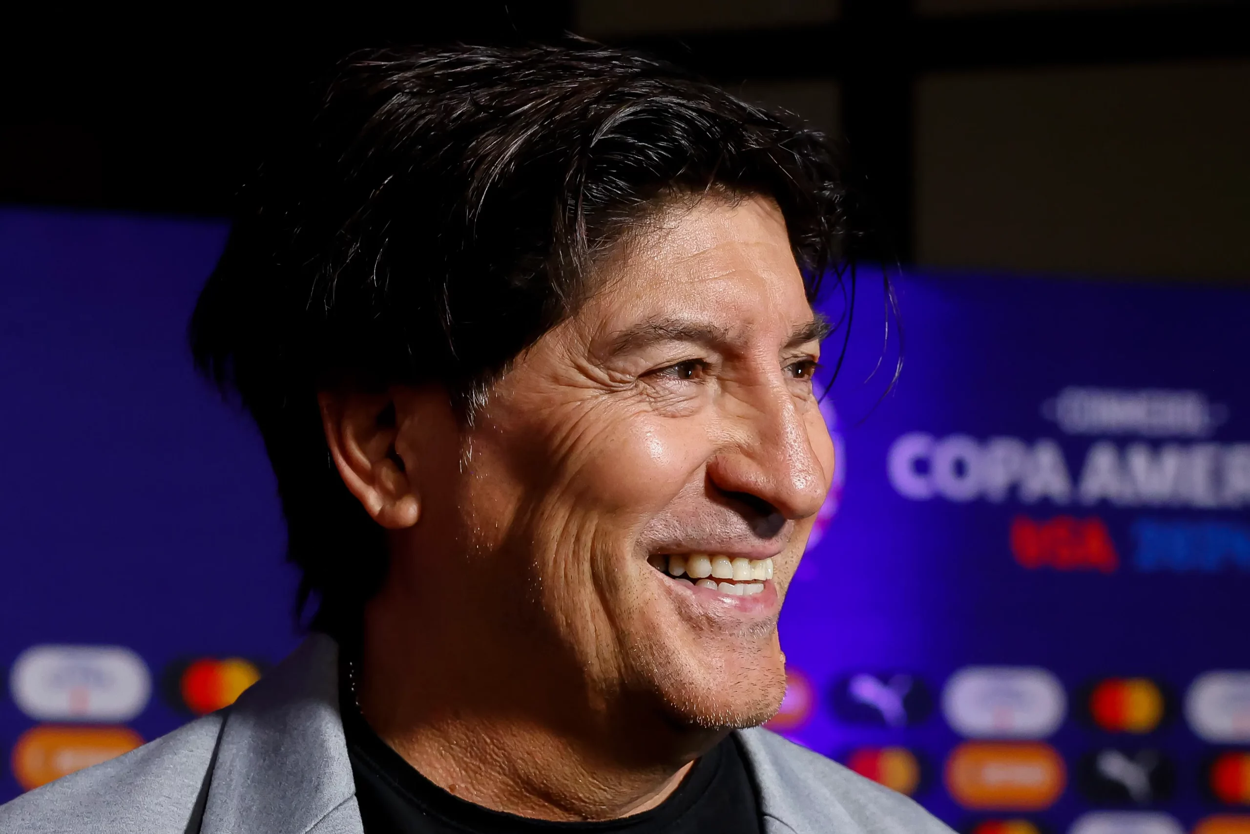 MIAMI, FLORIDA – DECEMBER 07: Chilean former player Ivan Zamorano smiles prior the official draw of CONMEBOL Copa America 2024 at James L. Knight Center on December 07, 2023 in Miami, Florida. (Photo by Eva Marie Uzcategui/Getty Images)