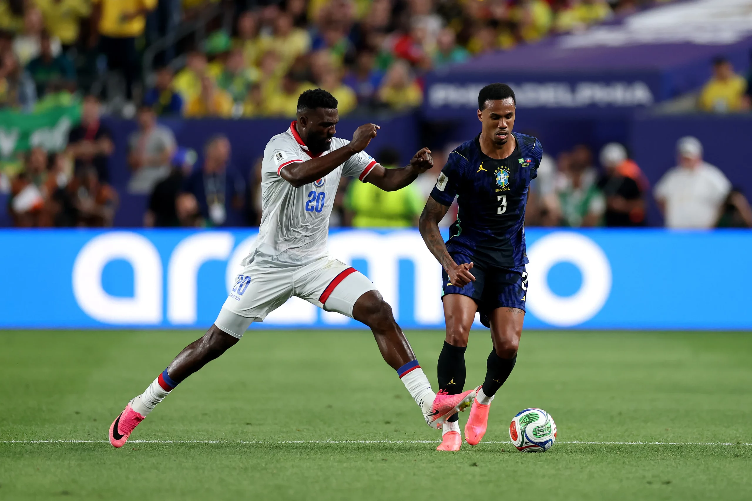 PHILADELPHIA, PENNSYLVANIA – JUNE 19: Gabriel Magalhaes #3 of Brazil is challenged by Frantzdy Pierrot #20 of Haiti during the FIFA World Cup 2026 Group C match between Brazil and Haiti at Philadelphia Stadium on June 19, 2026 in Philadelphia, Pennsylvania. (Photo by Dan Mullan/Getty Images)