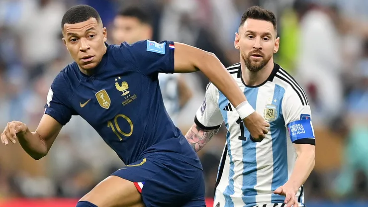LUSAIL CITY, QATAR - DECEMBER 18: Kylian Mbappe of France battles for possession with Lionel Messi of Argentina during the FIFA World Cup Qatar 2022 Final match between Argentina and France at Lusail Stadium on December 18, 2022 in Lusail City, Qatar. (Photo by Dan Mullan/Getty Images)