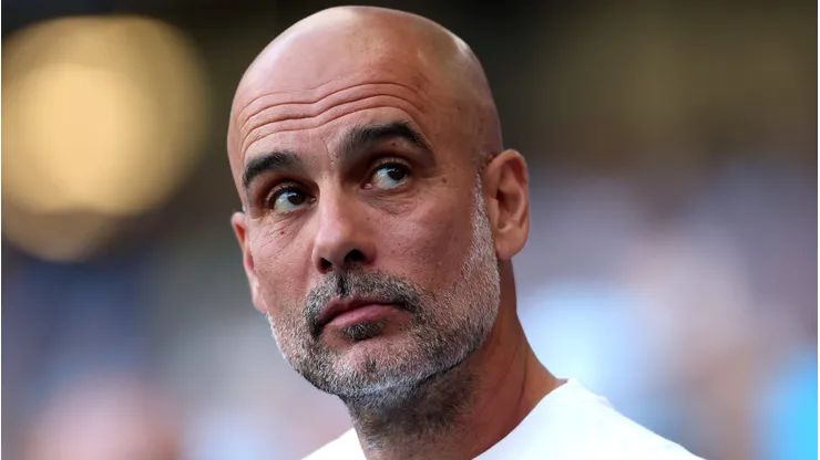 MANCHESTER, ENGLAND - MAY 24: Pep Guardiola, Manager of Manchester City, reacts as a montage of his time at Manchester City is played on the LED screen inside the stadium following the Premier League match between Manchester City and Aston Villa at the Etihad Stadium on May 24, 2026 in Manchester, England. (Photo by Carl Recine/Getty Images)