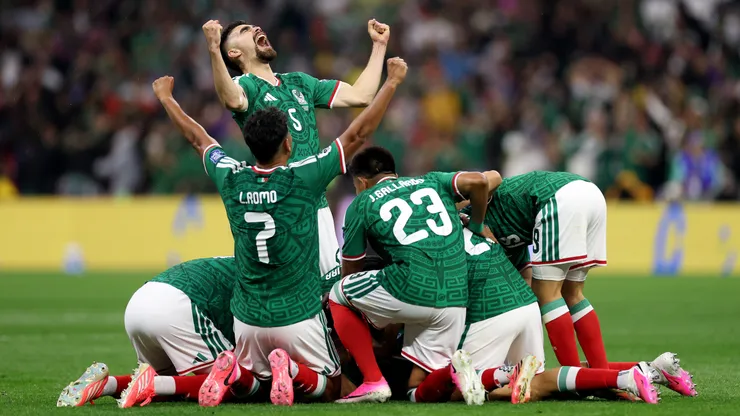 MEXICO CITY, MEXICO - JUNE 30: Raul Jimenez #9 of Mexico (obscured) celebrates scoring his team's second goal with Johan Vasquez #5 and team mates during the FIFA World Cup 2026 Round Of 32 match between Mexico and Ecuador at Mexico City Stadium on June 30, 2026 in Mexico City, Mexico. (Photo by Carl Recine/Getty Images)