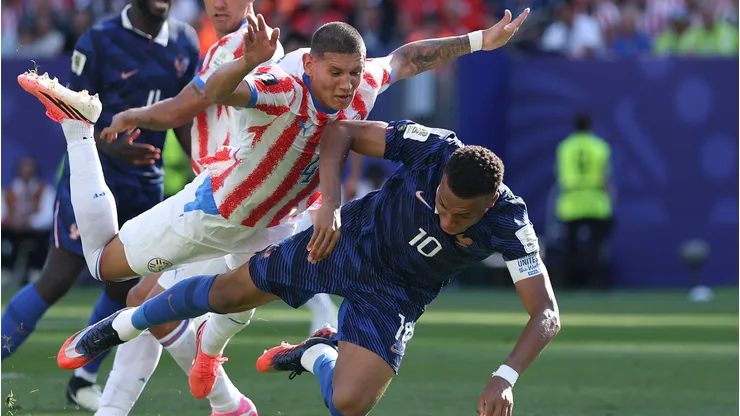 PHILADELPHIA, PENNSYLVANIA - JULY 04: Kylian Mbappe #10 of France and Juan Jose Caceres #4 of Paraguay compete for the ball during the FIFA World Cup 2026 Round of 16 match between Paraguay and France at Philadelphia Stadium on July 04, 2026 in Philadelphia, Pennsylvania. (Photo by Buda Mendes/Getty Images)
