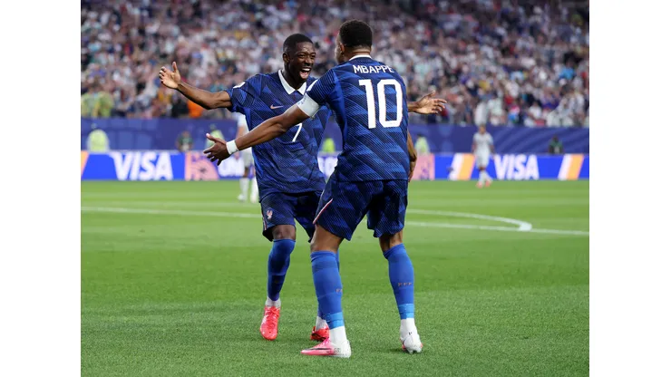 PHILADELPHIA, PENNSYLVANIA - JUNE 22: Kylian Mbappe #10 of France celebrates with teammate Ousmane Dembele #7 after scoring his team's second goal during the FIFA World Cup 2026 Group I match between France and Iraq at Philadelphia Stadium on June 22, 2026 in Philadelphia, Pennsylvania. (Photo by Dan Mullan/Getty Images)